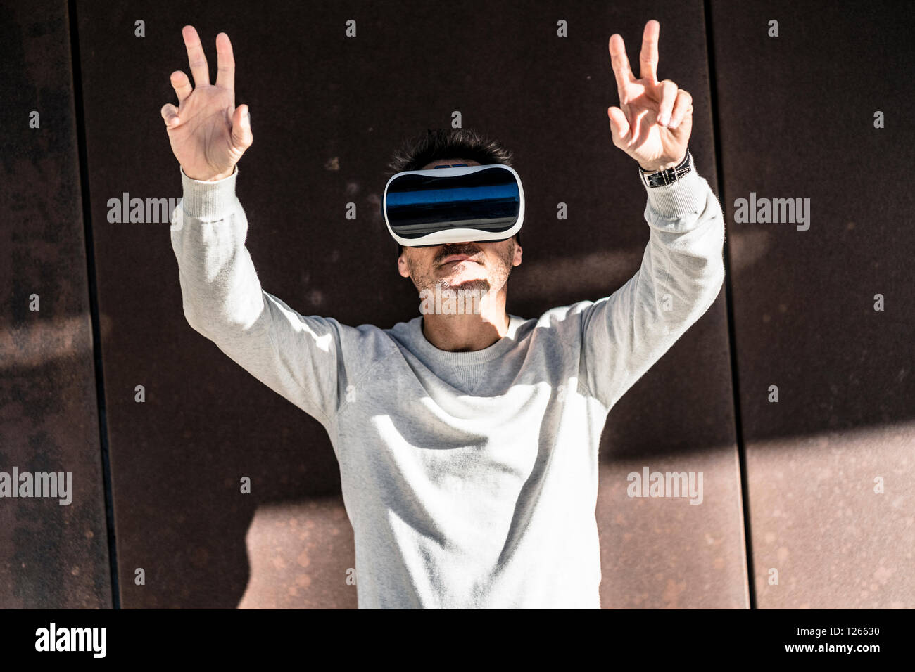 Mature man using VR glasses Stock Photo