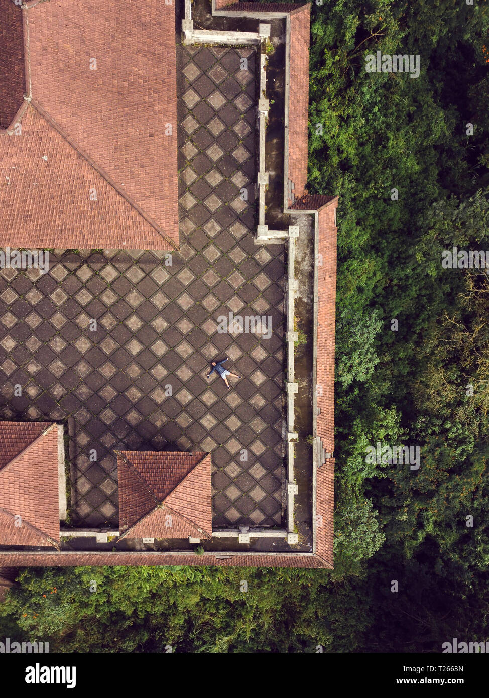 Indonesia, Bali, Aerial view of man on the roof terrace Stock Photo