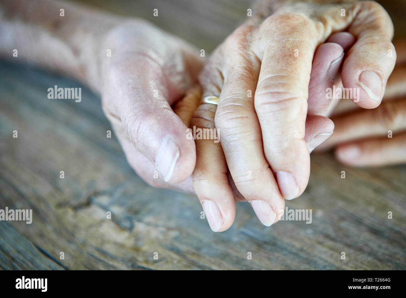 Senior couple holding hands, close-up Stock Photo