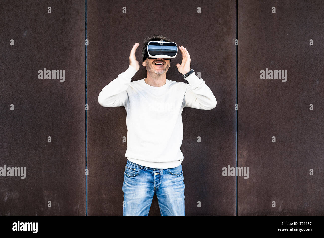 Mature man using VR glasses Stock Photo