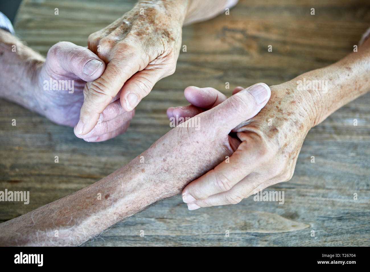 Senior couple holding hands, close-up Stock Photo