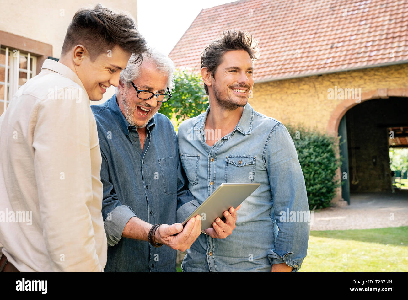 Three happy men of different age hi-res stock photography and images ...