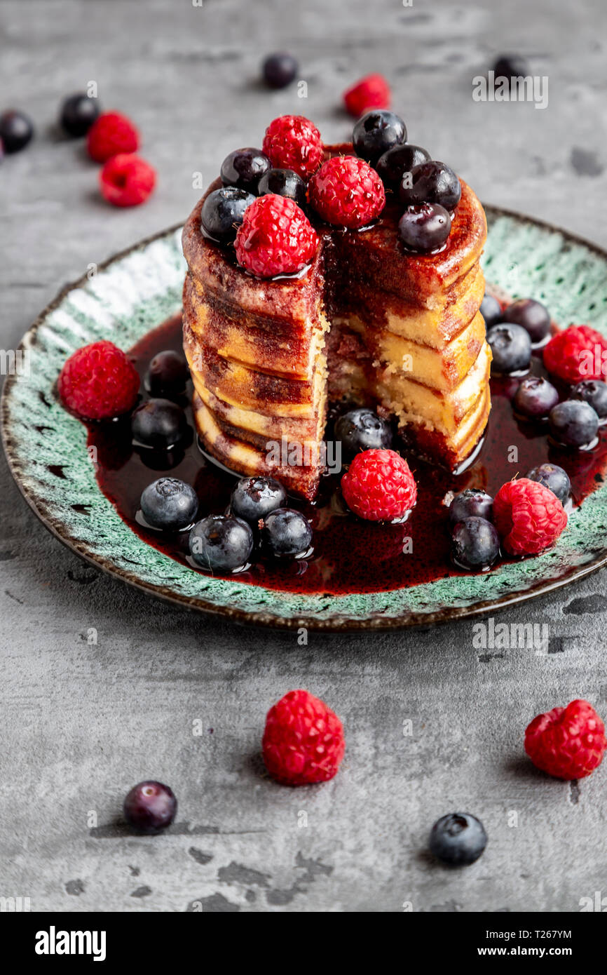 Pancakes with blueberries, raspberries and black currant sirup Stock ...