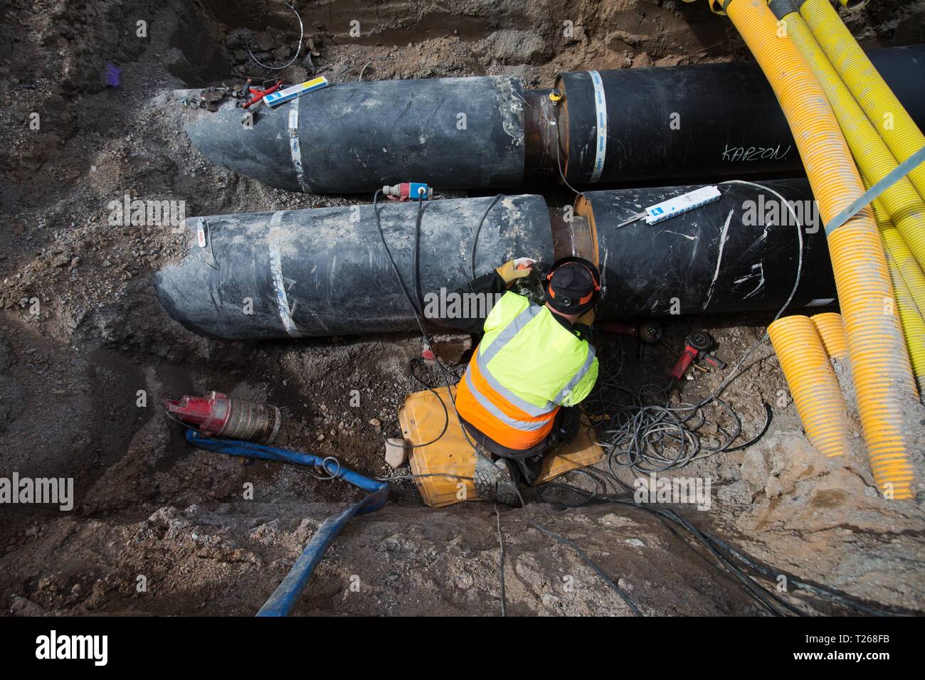 Fjärrvärme. District heating (also known as heat networks or teleheating) is a system for distributing heat generated in a centralized location through a system of insulated pipes for residential and commercial heating requirements such as space heating and water heating. Stock Photo