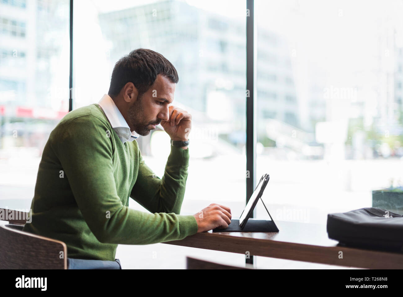 Business man using tablet in cafe Stock Photo