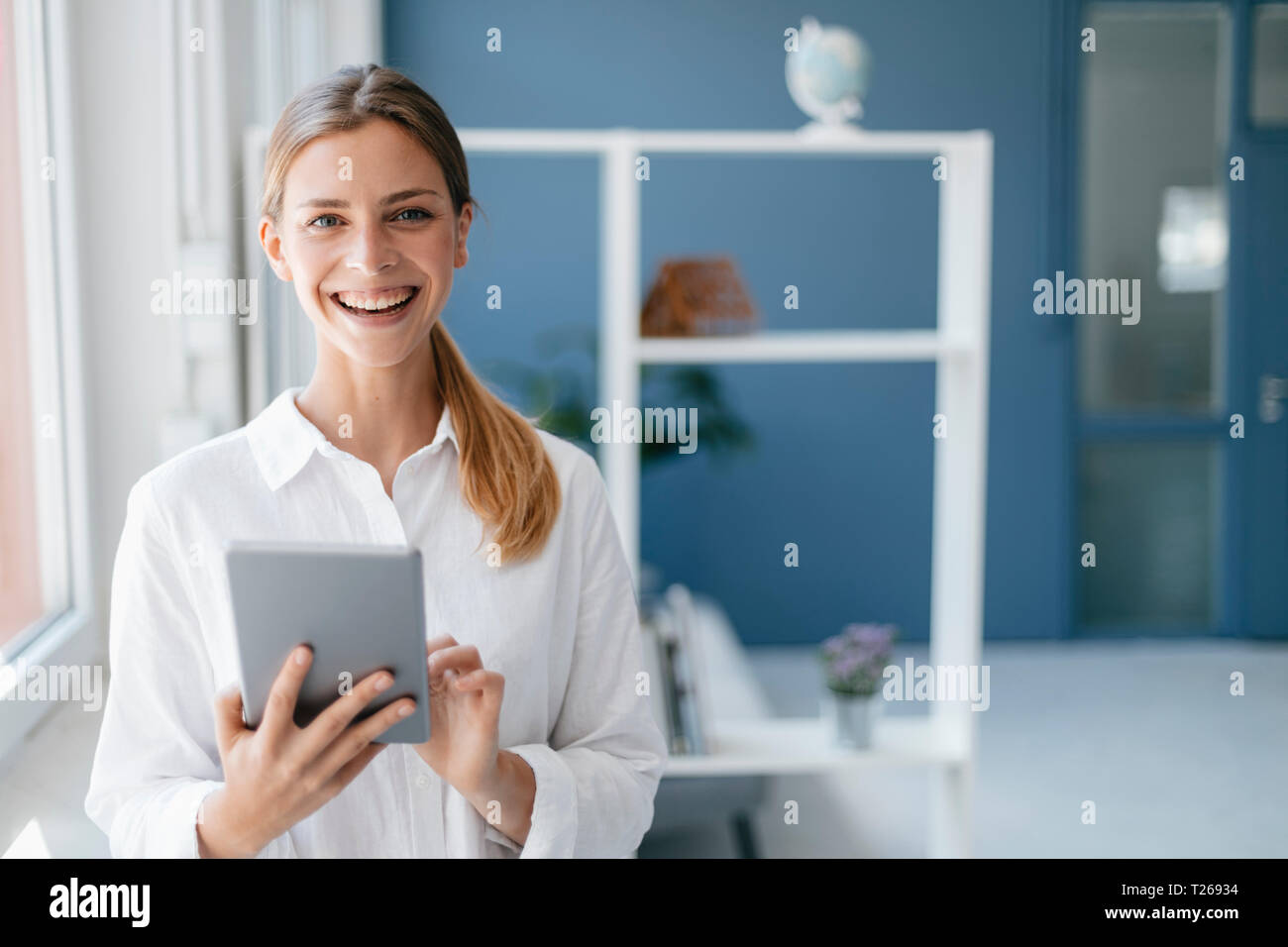 Young woman using digital tablet Stock Photo
