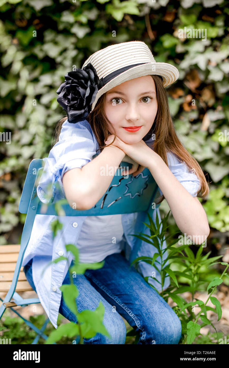 Portrait of girl sitting on chair hi-res stock photography and images ...