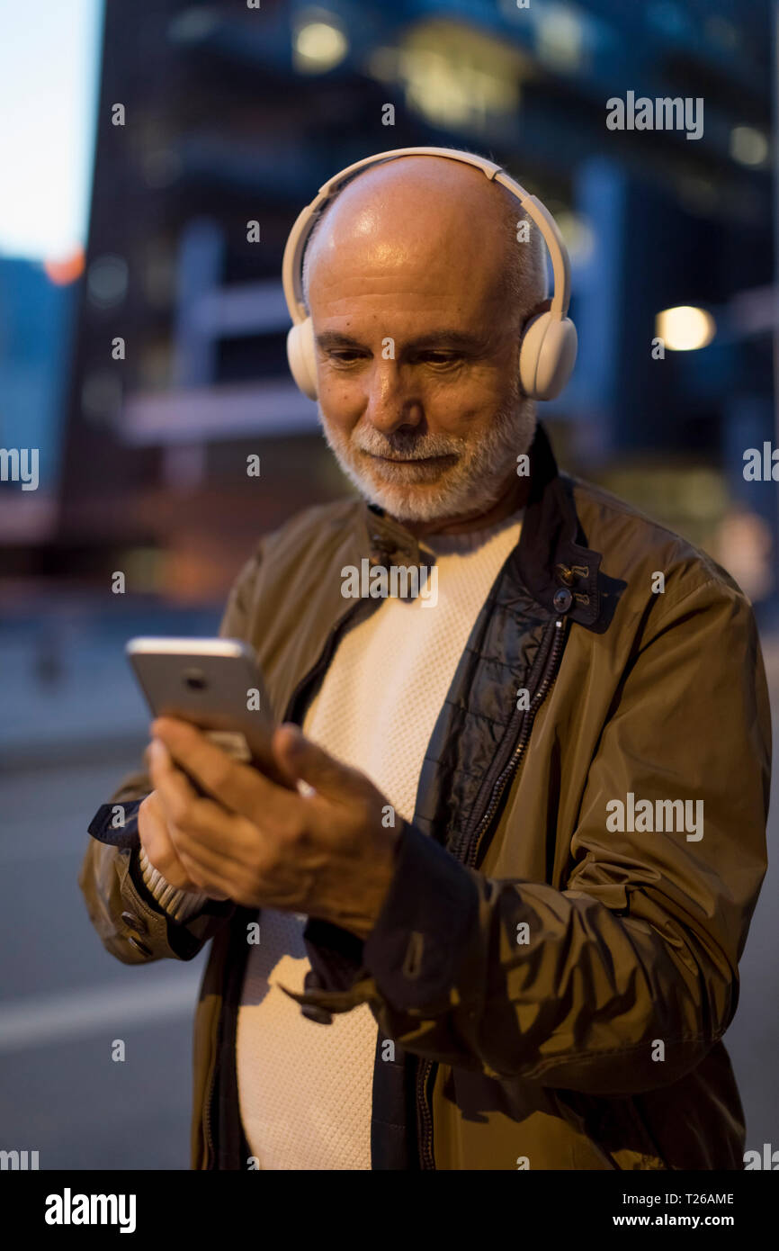 Senior man headphones hi-res stock photography and images - Alamy