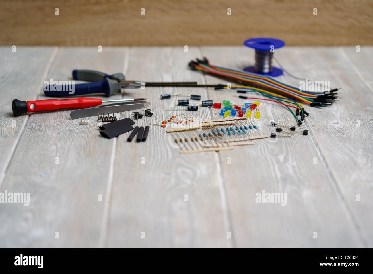 leds, resistors and electronic components with tools on a white vintage background Stock Photo