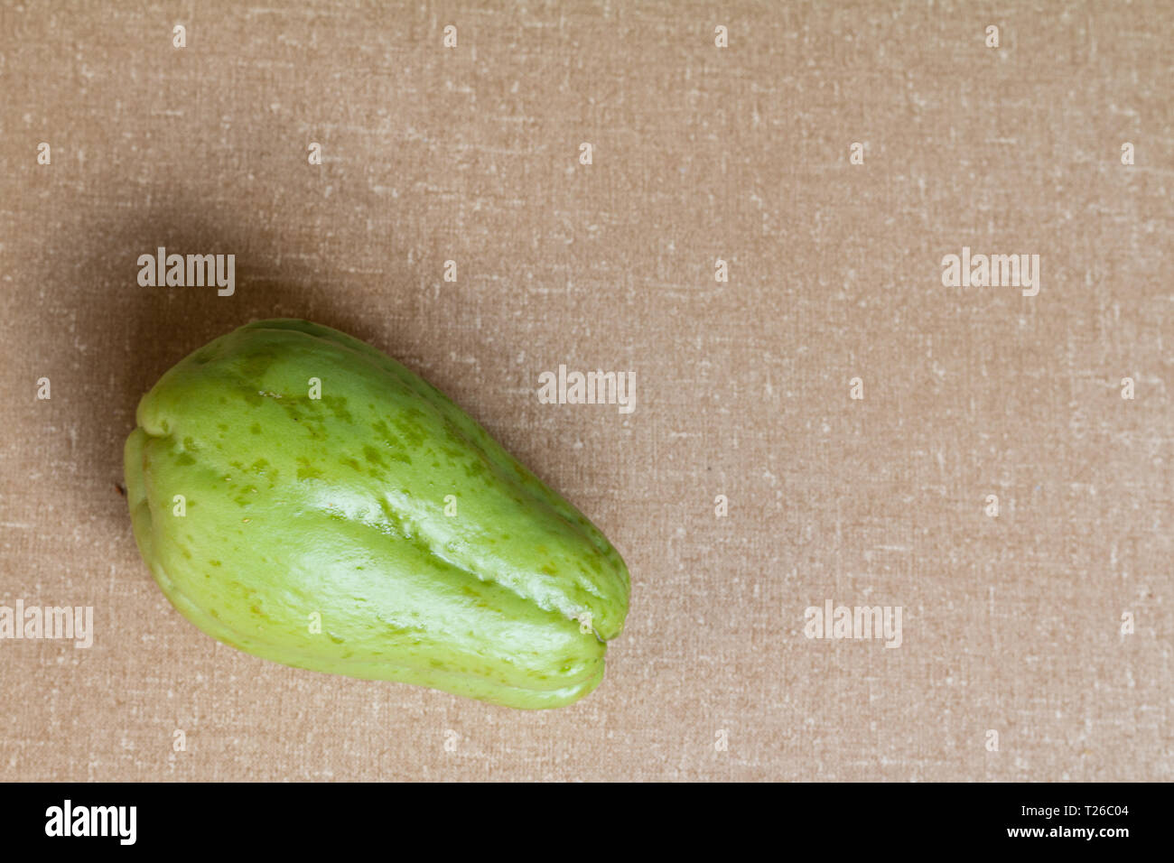 Chayote with textured background. Stock Photo