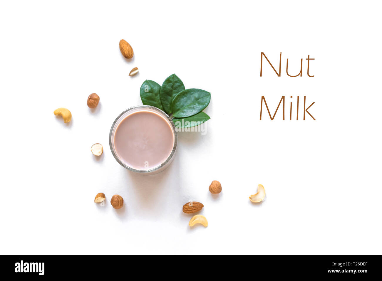 Nut Milk alternative isolated on white background, copy space, top view. Healthy vegan substitute dairy free drink - almond hazelnut cashew milk. Stock Photo