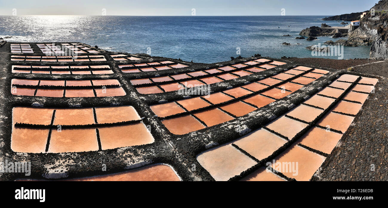 Salt evaporation ponds in front of Faro de Fuencaliente (Canary Islands) Stock Photo