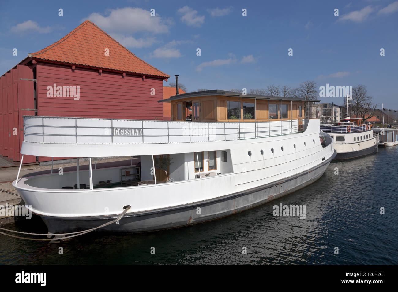 Houseboats Iggesund and Viking in Proviantmagasingraven canal, at Holmen, Copenhagen inner harbour, denmark. Stock Photo