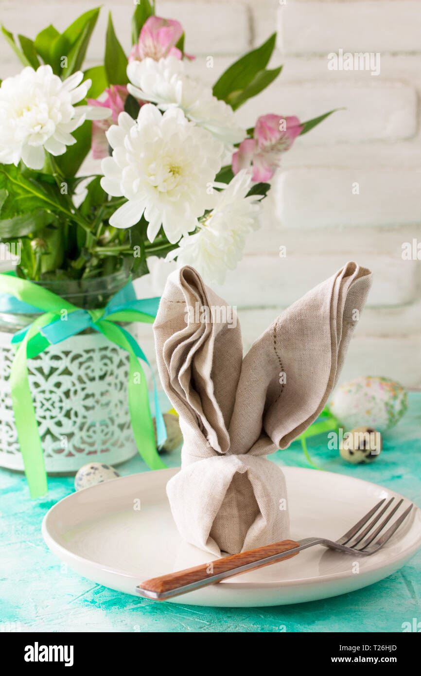 Holidays Easter table Setting with spring flowers. Stock Photo