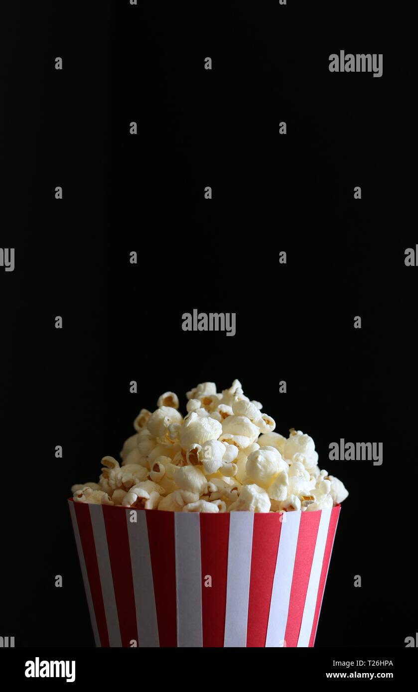 Popcorn bag isolated on dark background Stock Photo
