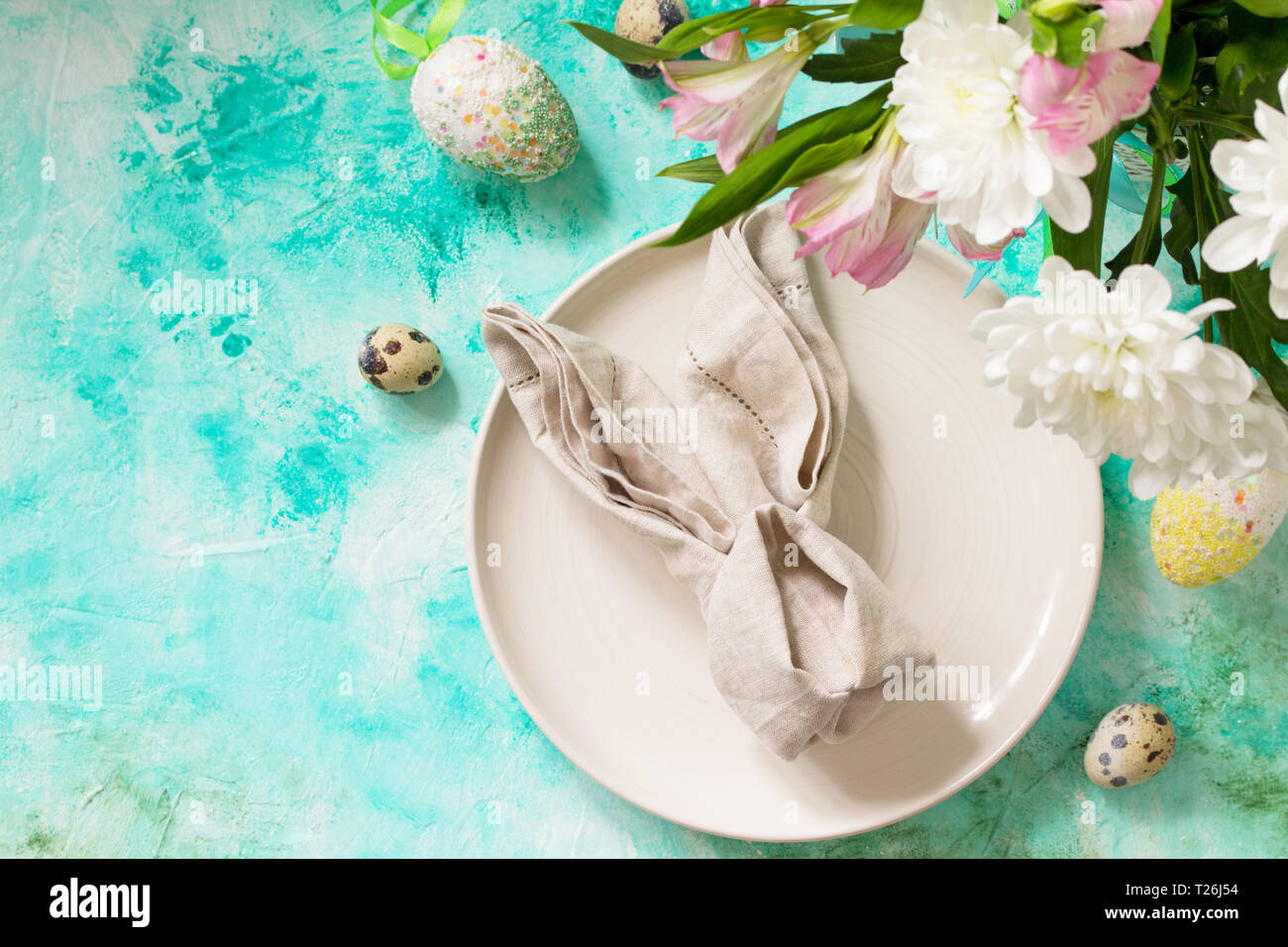 Holidays Easter table Setting with spring flowers. Top view flat lay background with copy space. Stock Photo