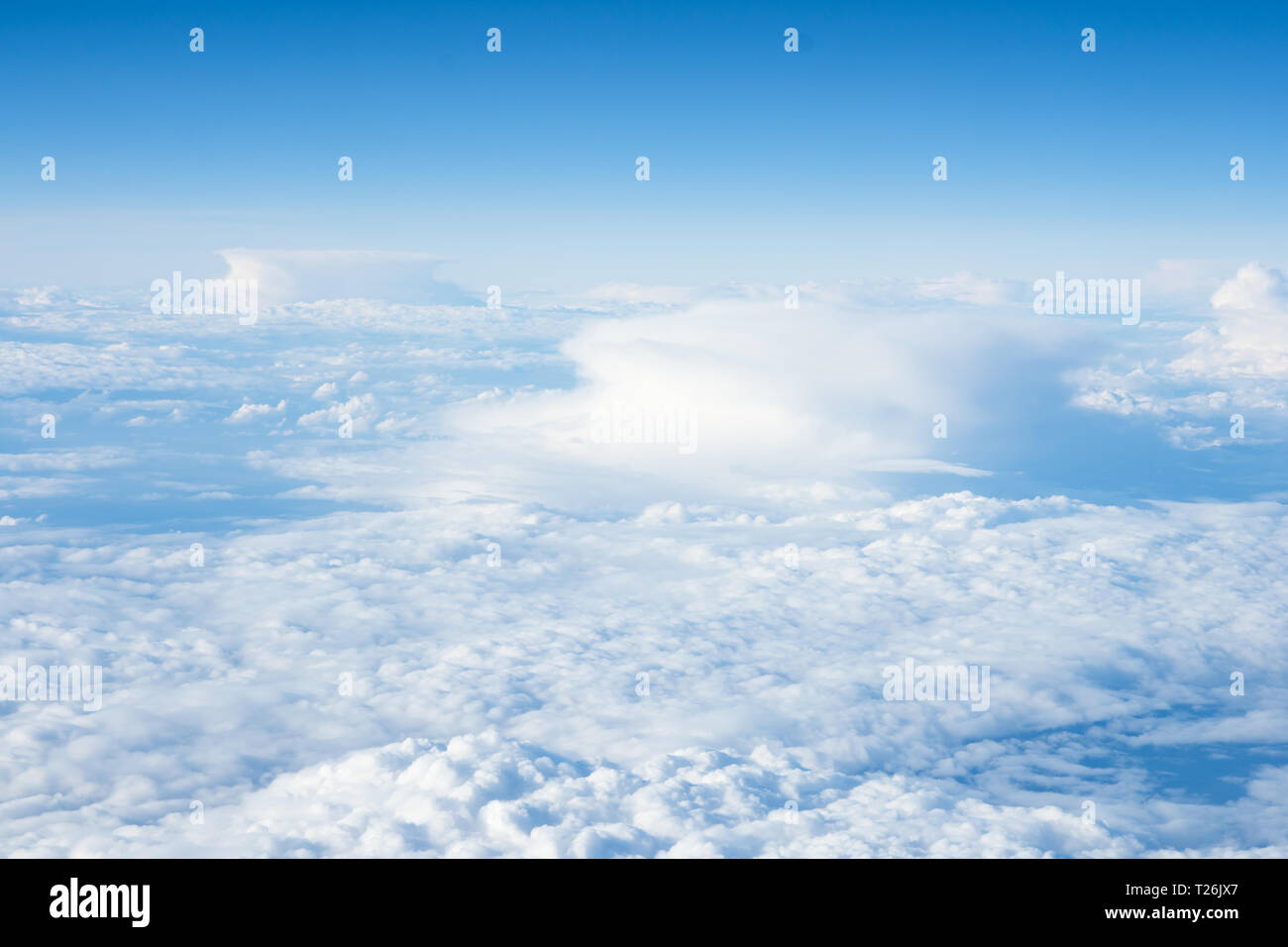 Impressive cloudscape with white clouds beneath blue sky Stock Photo
