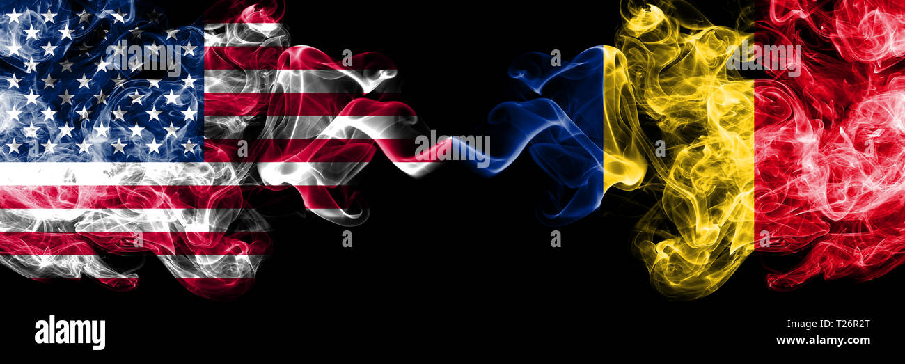 United States of America vs Romania, Romanian smoky mystic flags placed side by side. Thick colored silky smoke flags of America and Romania, Romanian Stock Photo