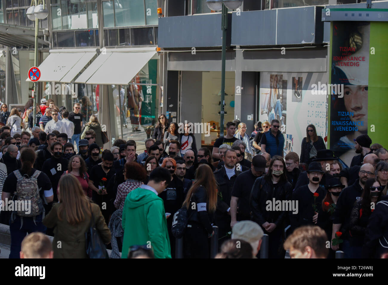 Frankfurt, Germany. 30th March 2019. The mourner follow the pallbearers who carry the coffin through the city centre of Frankfurt. Around 100 people marched through the centre of Frankfurt, to mourn the free Internet, after the EU Parliament has voted in favour of the EU Copyright Directive. They were carrying a coffin and were reading eulogies to the Internet. Stock Photo