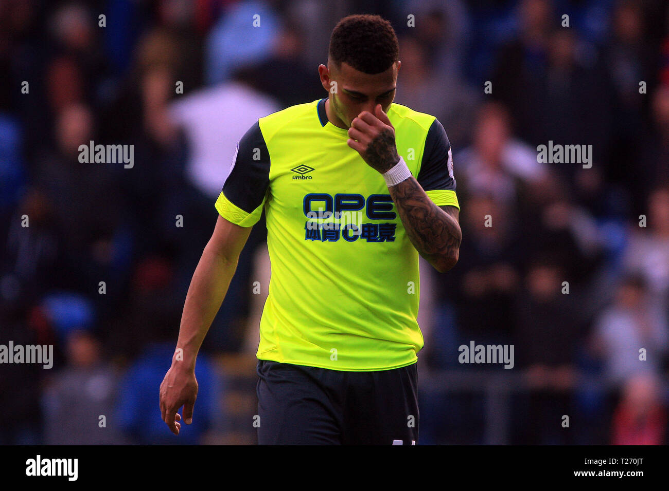 London, UK. 30th March 2019. Karlan Grant of Huddersfield Town is dejected after his teams relegation is confirmed. Premier League match, Crystal Palace v Huddersfield Town at Selhurst Park in London on Saturday 30th March 2019.  this image may only be used for Editorial purposes. Editorial use only, license required for commercial use. No use in betting, games or a single club/league/player publications. pic by Steffan Bowen/Andrew Orchard sports photography/Alamy Live news Stock Photo