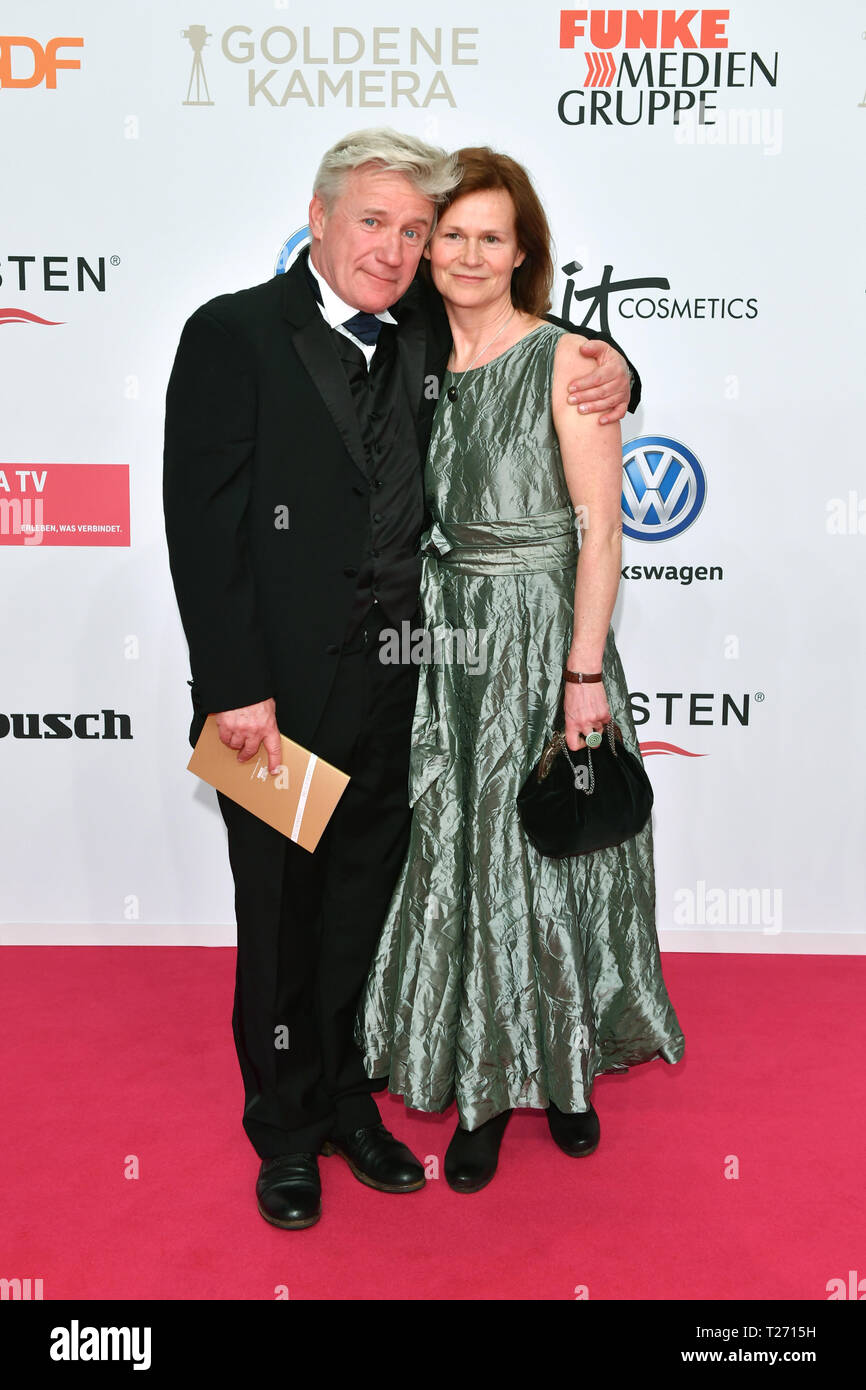 Berlin, Germany. . 30th Mar, 2019. Jörg Schüttauf and his wife Martina Beeck come to the Golden Camera award ceremony. The award ceremony will take place at Berlin's disused Tempelhof Airport. Credit: Jens Kalaene/dpa-Zentralbild/dpa/Alamy Live News Stock Photo