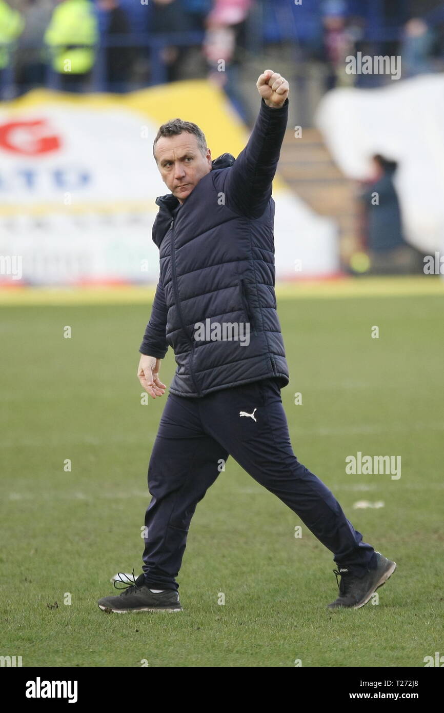 Birkenhead, Wirral, UK. 30th March, 2019. Tranmere Rovers Manager Micky Mellon salutes Tranmere fans after the EFL League Two match with Carlisle United at Prenton Park which Tranmere Rovers won 3-0. Stock Photo