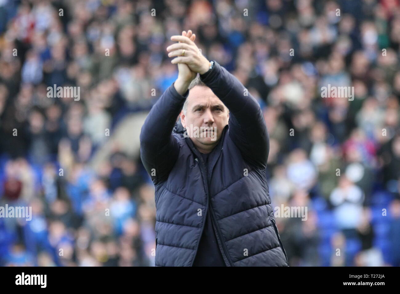 Birkenhead, Wirral, UK. 30th March, 2019. Tranmere Rovers Manager Micky Mellon applauds Tranmere fans ahead of the EFL League Two match with Carlisle United at Prenton Park which Tranmere Rovers won 3-0. Stock Photo