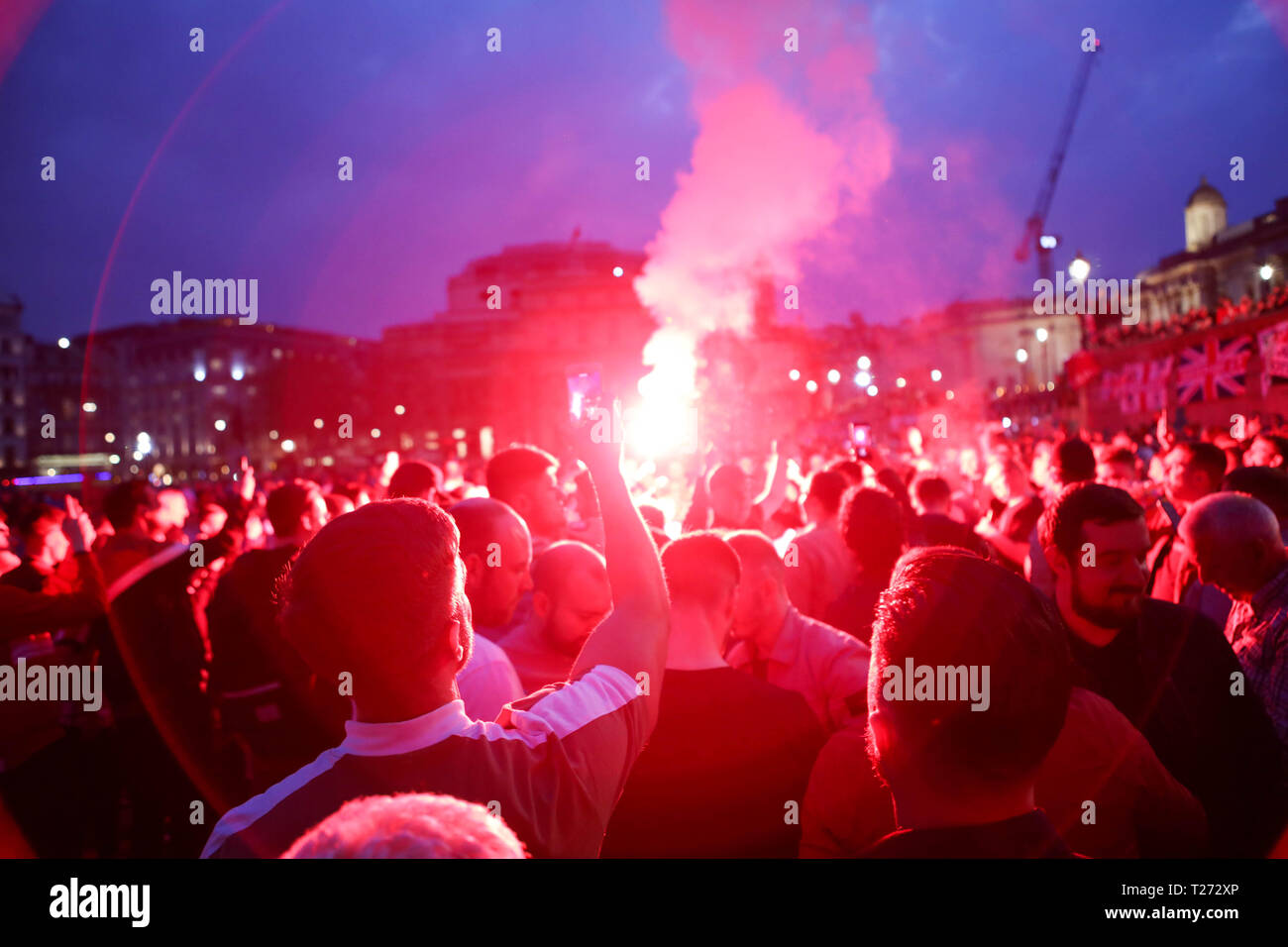 London, UK. 30th March, 2019. Travelling Sunderland supporters on the evening before their EFL Trophy final against Portsmouth at Wembley take over Trafalgar Square. Penelope Barritt/Alamy Live News Stock Photo