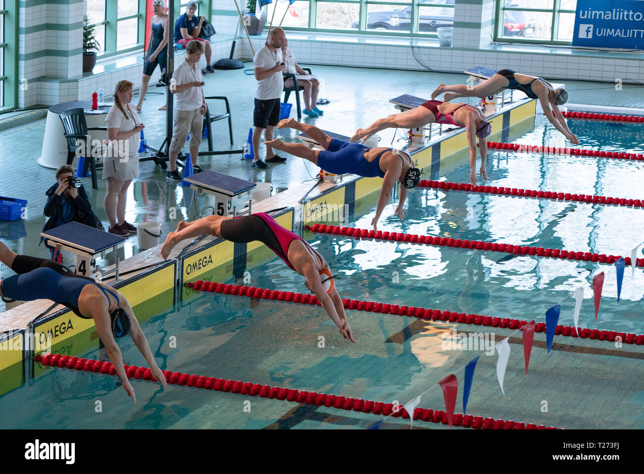 Swimmers racing in pool lanes hi-res stock photography and images - Alamy