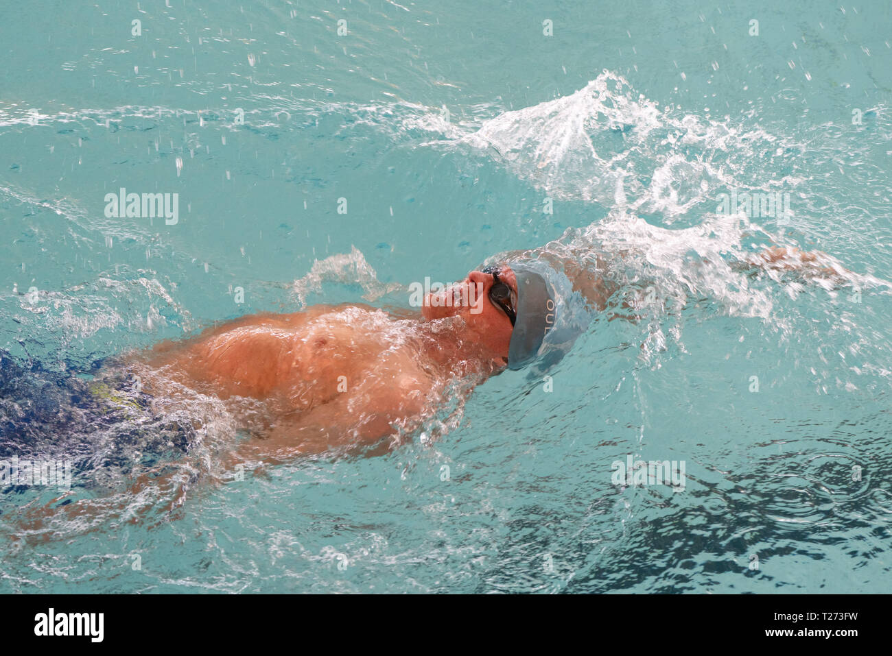 Swimmers racing in pool lanes hi-res stock photography and images - Alamy