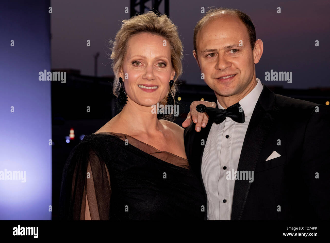 Berlin, Germany. 30th Mar, 2019. Anna Schudt and her husband Moritz Führmann, both actors, are standing on the red carpet in front of the Golden Camera award ceremony at Berlin's disused Tempelhof Airport. Credit: Christoph Soeder/dpa/Alamy Live News Stock Photo