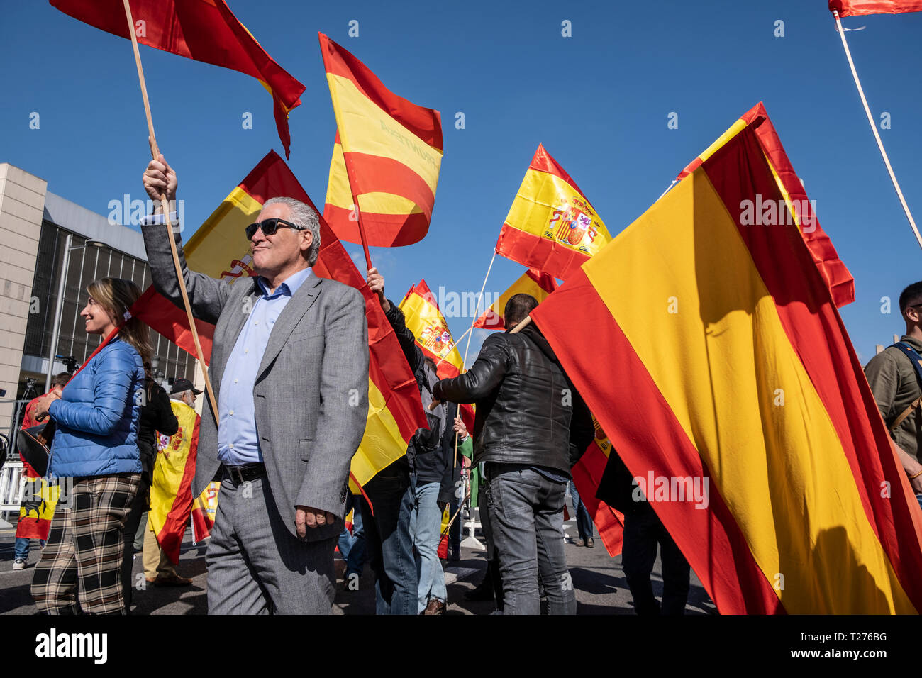 Barcelona, Spain. 30th March 2019. Protesters are seen waving the Spanish flags during the demonstration. The political formation of Santiago Abascal has concentrated in Barcelona demanding the liberation of Catalonia, the suspension of autonomy, the dissolution of the Catalan police force and the closure of public television TV3, about two thousand people attended the event with numerous Spanish flags in the Plaza España of Barcelona Credit: SOPA Images Limited/Alamy Live News Stock Photo