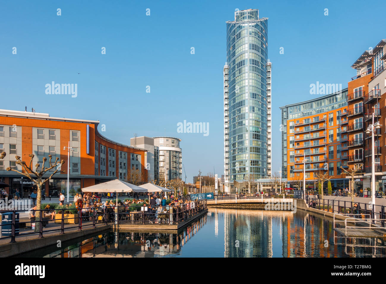 The Lipstick Tower at Gunwharf Quays in Portsmouth seen on a sunny day with clear blue skies. Stock Photo