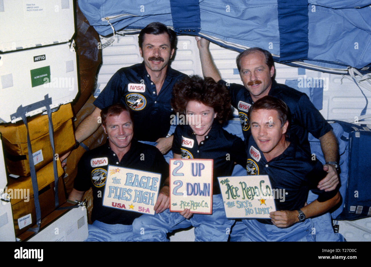 51A-13-028 (12 Nov 1984) --- The five-member crew celebrates a successful mission. The reference to the eagle has to do with the Discovery crew’s  mascot, which appeared both in its crew portrait and insignia.  L-R (front row) astronauts David M. Walker, Anna Lee Fisher and Joseph P. Allen; (back row) Dale A. Gardner and Frederick H. (Rick) Hauck. Stock Photo