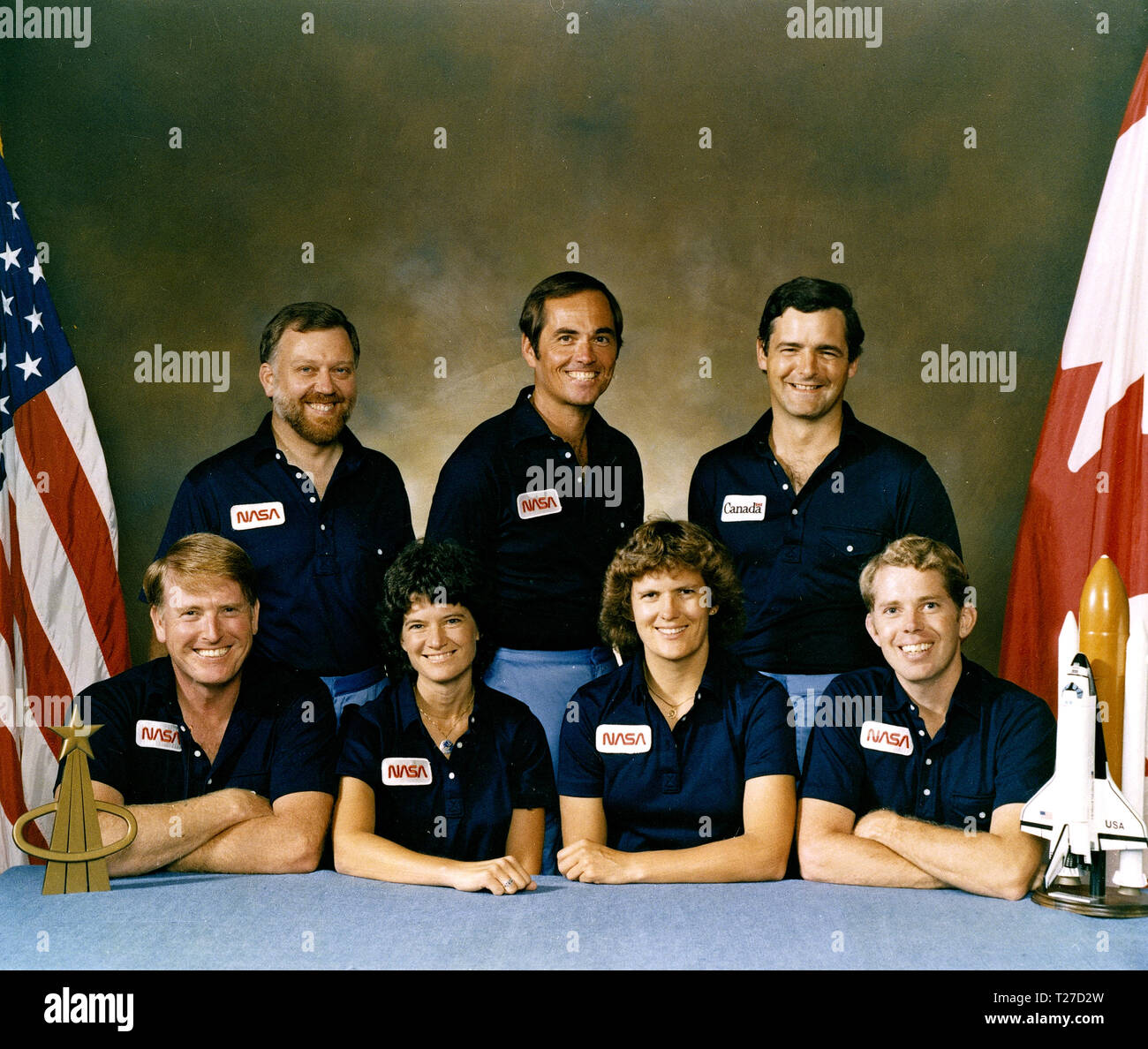 The crew assigned to the STS-41G mission included (seated left to right) Jon A. McBride, pilot; mission specialists Sally K. Ride, Kathryn D. Sullivan, and David C. Leestma. Standing in the rear, left to right, are payload specialists Marc Garneau, and Paul D. Scully-Power. Stock Photo