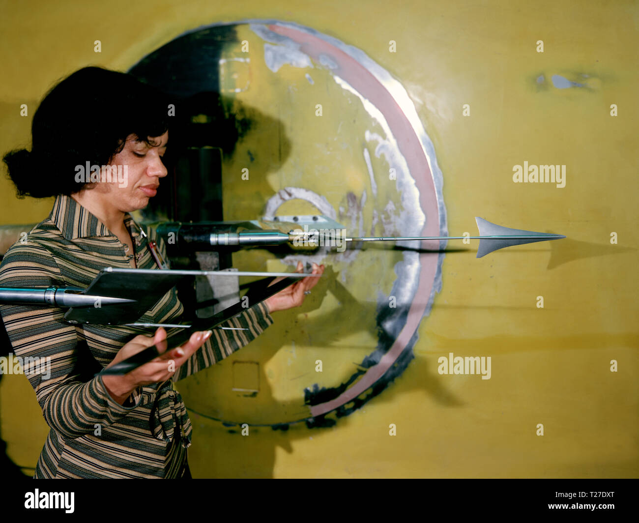 Sonic Boom test model and measuring probe rake with Christine Darden