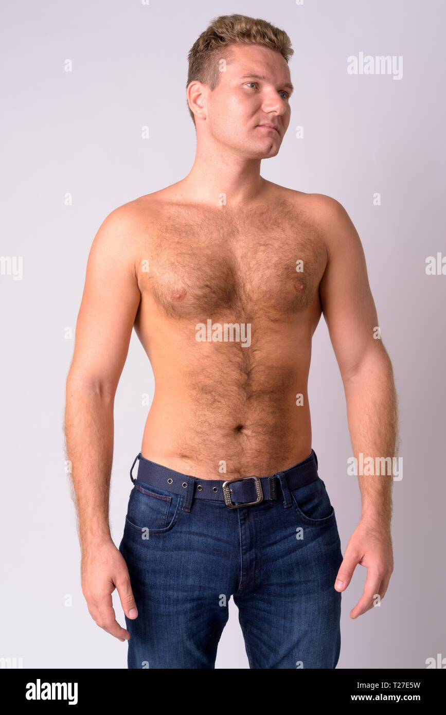 Portrait Of Young Blonde Shirtless Man With Chest Hair Thinking