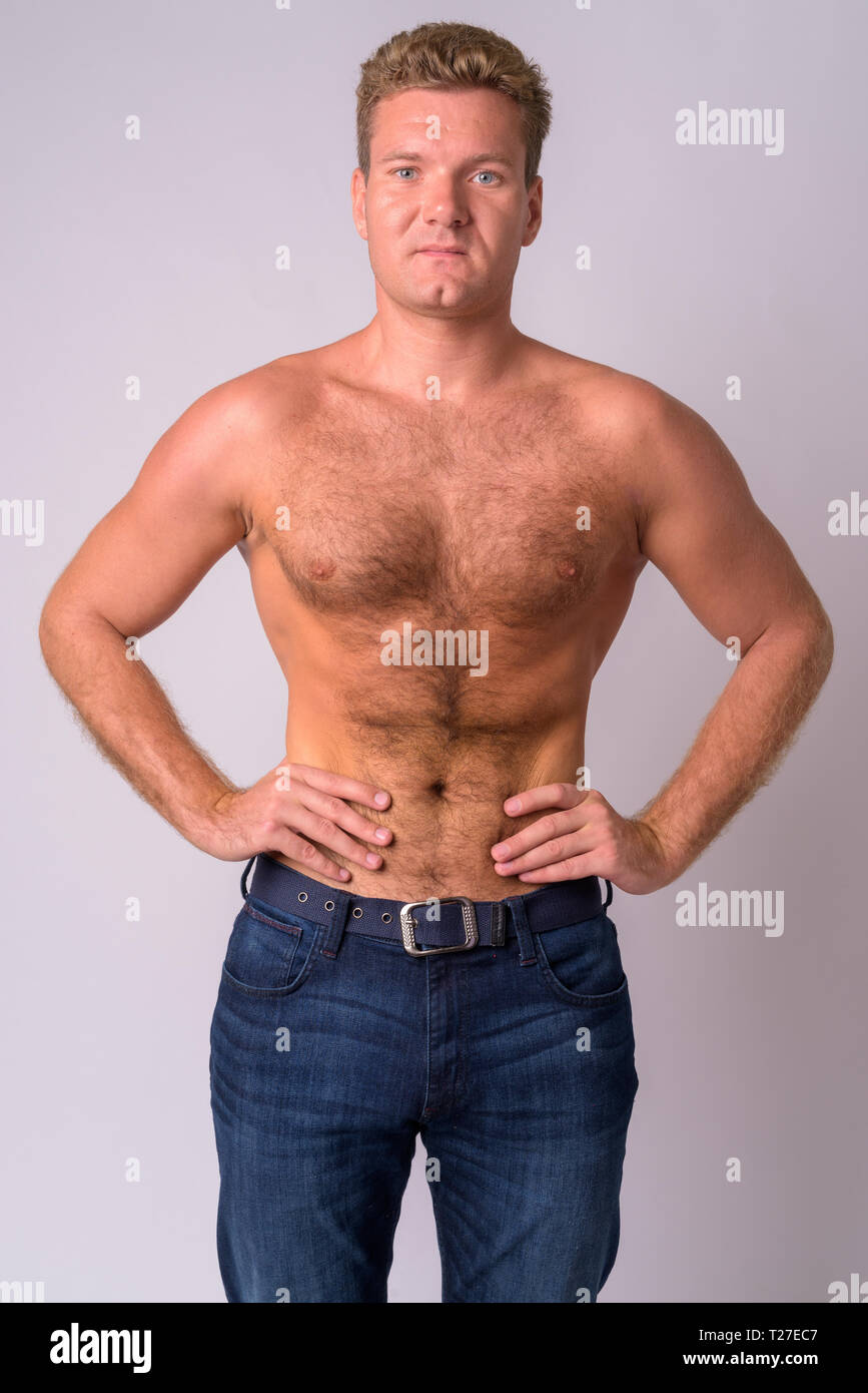 Portrait of young blonde man shirtless with chest hair Stock Photo - Alamy