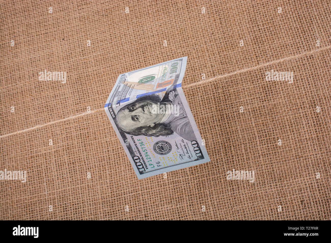 Banknote of US dollar hanging on a linen string Stock Photo - Alamy