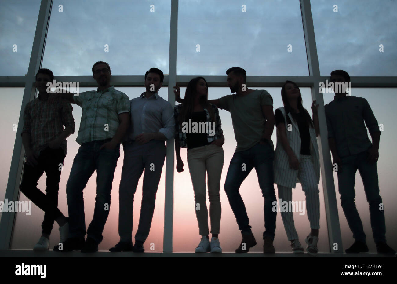 creative business team standing near the office window Stock Photo - Alamy