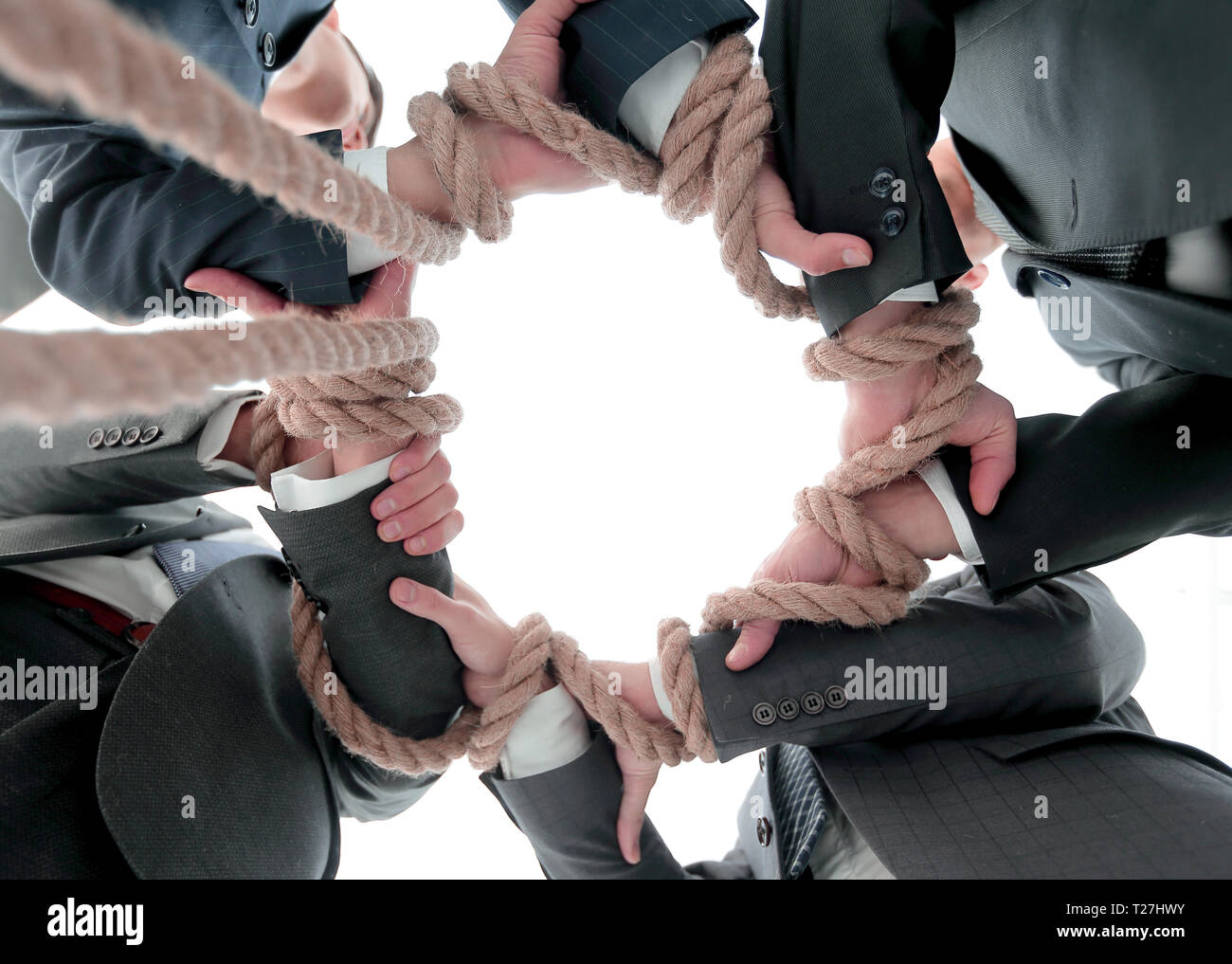 business team holding strong rope Stock Photo - Alamy