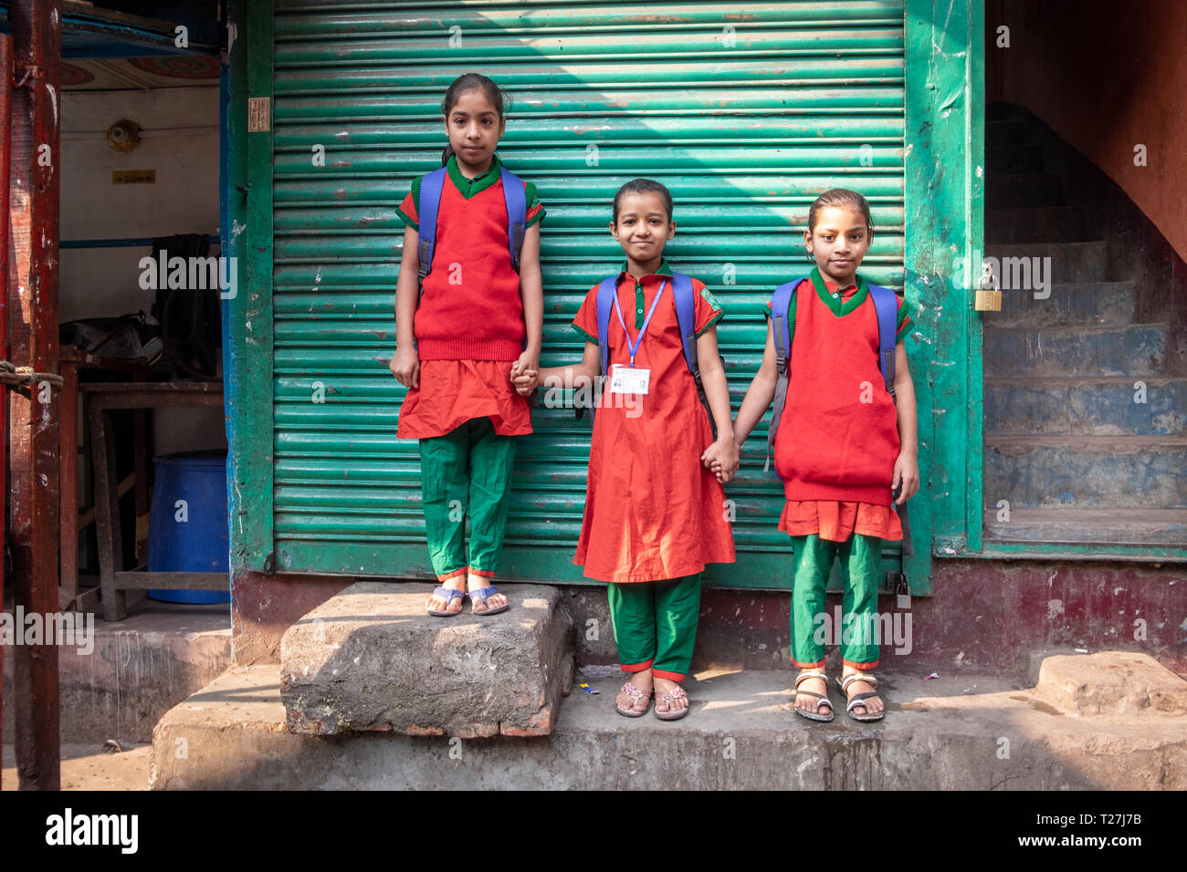 3 girls in red and green national colors school uniforms are getting back  home. Geneva Camp, stranded Pakistanis enclave in Dhaka, Bangladesh Stock  Photo - Alamy
