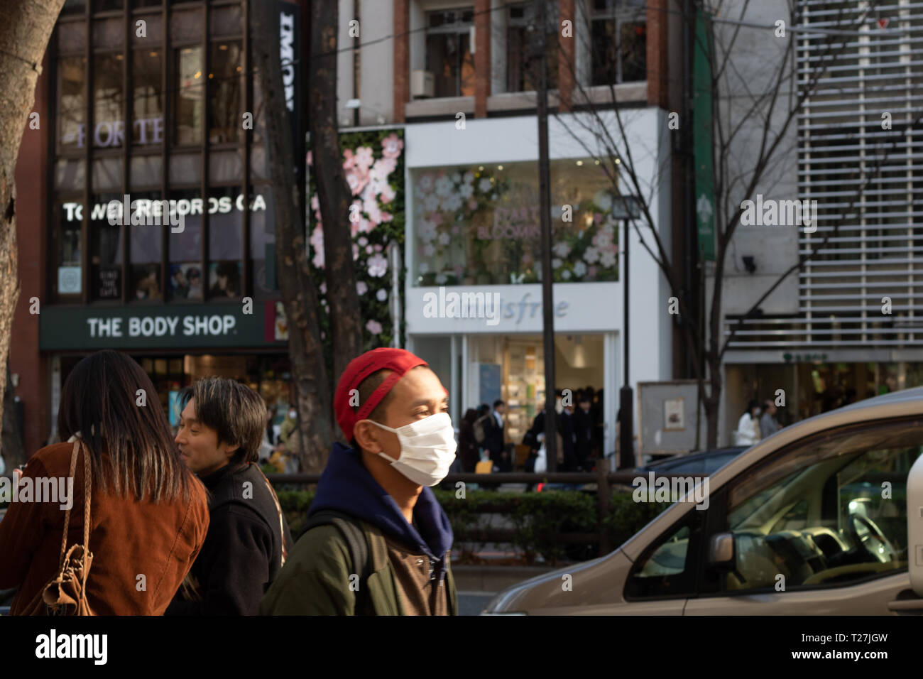 Did you know that people from Tokyo call themselves Tokyokkos? And many Tokyokkos were health masks. Stock Photo