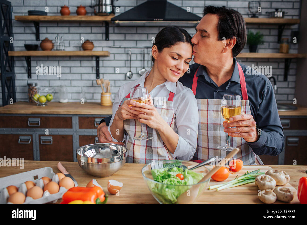 Lovely picture of man sitting with woman together at table in kitchen ...
