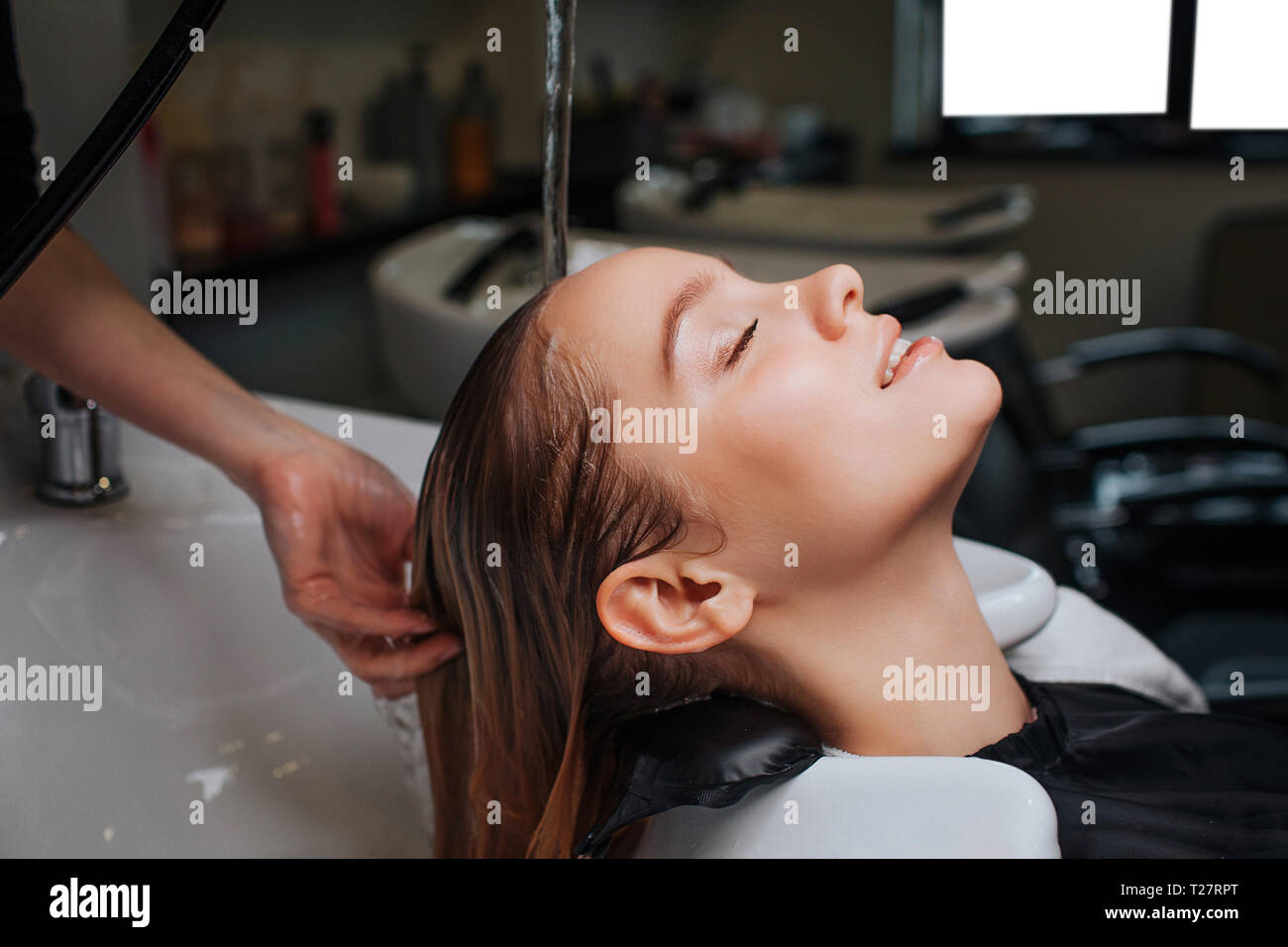 Side View Of Beautiful Young Woman With Closed Eyes Smiling While Hairdresser Rising Hair After Shampoo Hair Spa In Beauty Salon Stock Photo Alamy https www alamy com side view of beautiful young woman with closed eyes smiling while hairdresser rising hair after shampoo hair spa in beauty salon image242346800 html