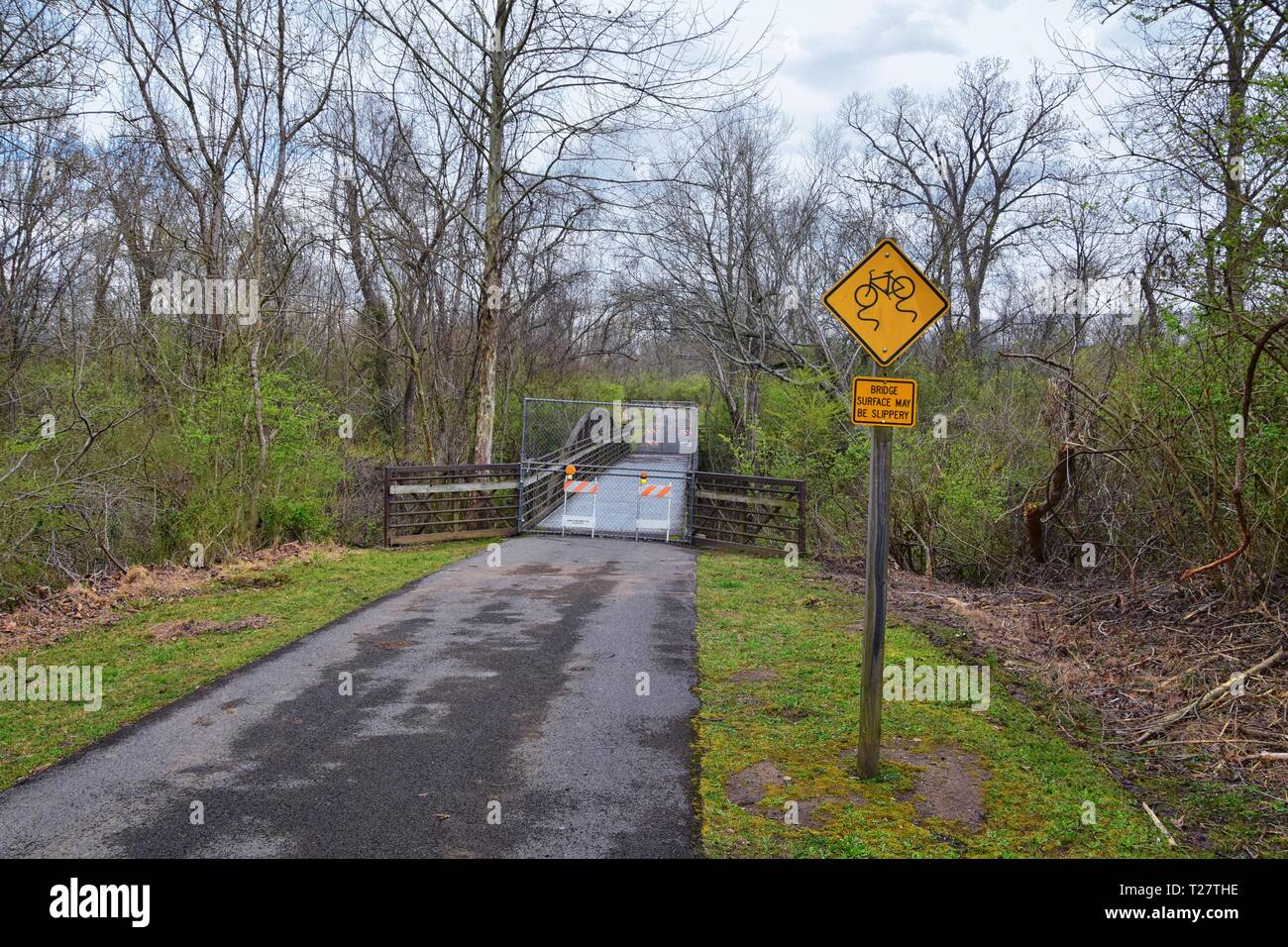 Trail and warning signs along the Shelby Bottoms Greenway and Natural