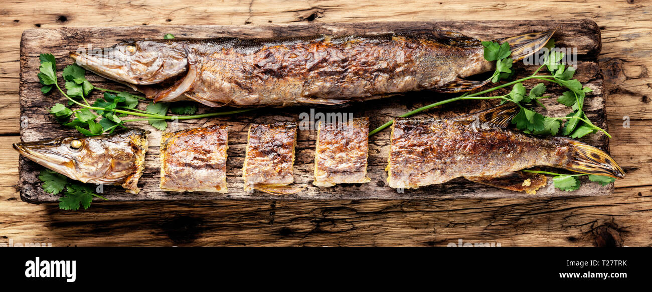Baked grilled fish.Pike fish stuffed with mushrooms.Pike royally. Russian  cuisine Stock Photo - Alamy