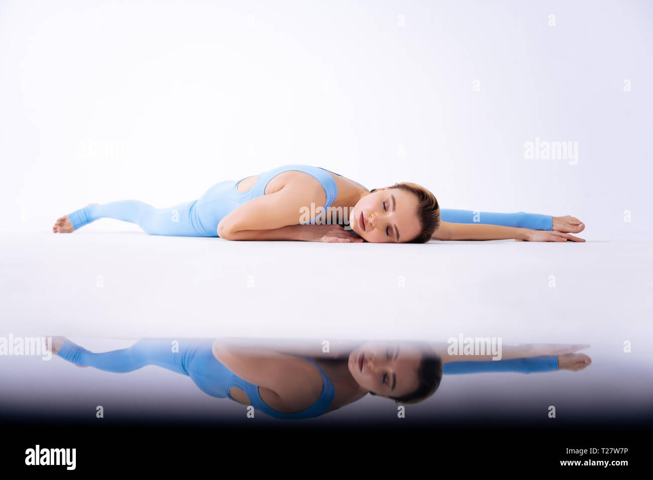 Calm relaxed woman lying with her eyes closed Stock Photo - Alamy