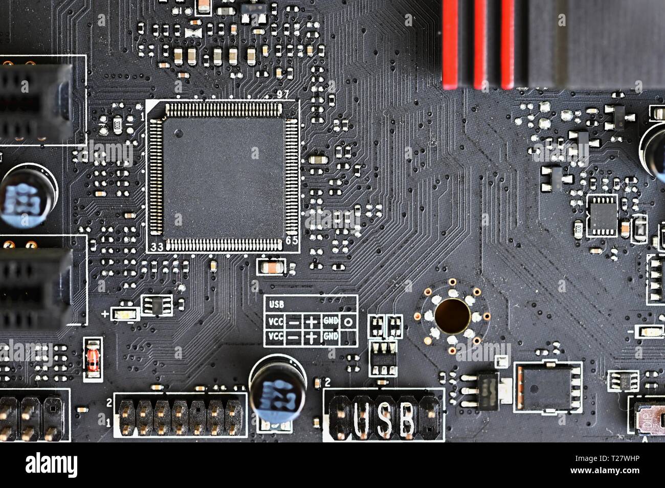 Printed Circuit Board with electrical components. Background concept for electrical engineering and modern technology Stock Photo