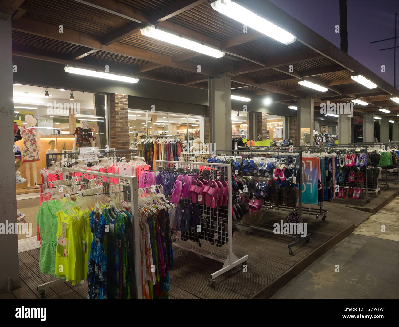 After dark shopping for beachwear along the main street in the holiday resort Ayia Napa Cyprus Stock Photo